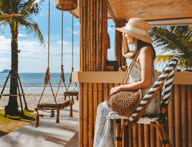 travel-summer-vacation-concept-happy-traveler-asian-woman-with-hat-dress-relax-swing-beach-cafe-koh-chang-thailand